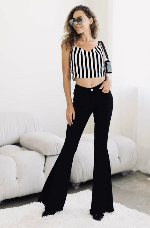Women's Black High Rise, With Distinctive 70's Flare, Jeans With Frayed Edging Around The Bottom Of Each Jean Leg, Stretch Fabric & Button Front