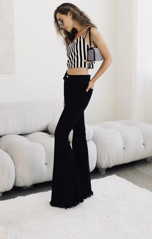 Women's Black High Rise, With Distinctive 70's Flare, Jeans With Frayed Edging Around The Bottom Of Each Jean Leg, Stretch Fabric & Button Front