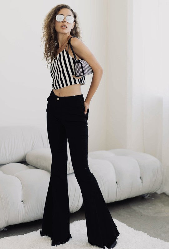 Women's Black High Rise, With Distinctive 70's Flare, Jeans With Frayed Edging Around The Bottom Of Each Jean Leg, Stretch Fabric & Button Front